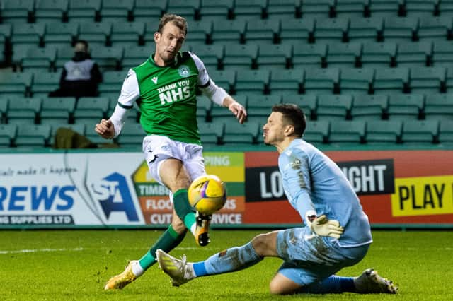 Dundee United goalkeeper Benjamin Siegrist saves an effort from Hibs striker Christian Doidge during their sides' draw at Easter Road. Photo by Ross Parker / SNS Group