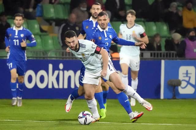 John McGinn tenses his celebrated buttocks to bump off Moldovan resistance and Scotland are on the attack again