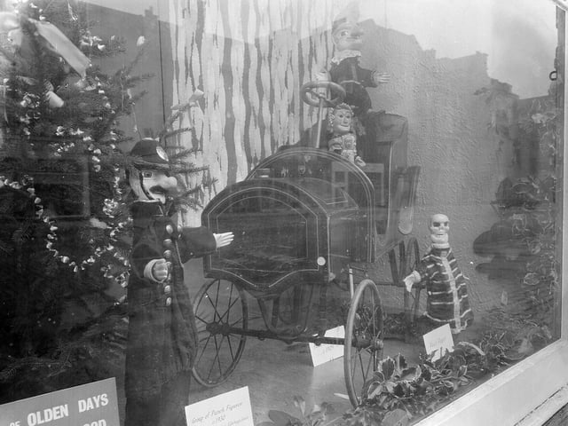 The window display at the Music Hall, on George Street, just before Christmas 1962 featured Punch and Judy figures and a mechanical train.