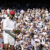 Australia's Nick Kyrgios pretends to use the runners-up trophy as a frisbee after losing to Serbia's Novak Djokovic in the final of the men's singles.