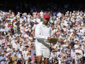 Australia's Nick Kyrgios pretends to use the runners-up trophy as a frisbee after losing to Serbia's Novak Djokovic in the final of the men's singles.