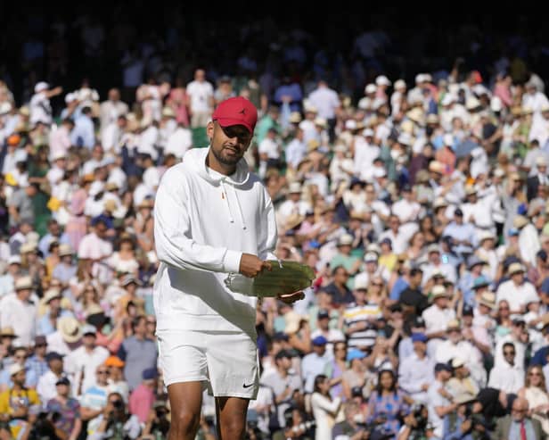 Australia's Nick Kyrgios pretends to use the runners-up trophy as a frisbee after losing to Serbia's Novak Djokovic in the final of the men's singles.