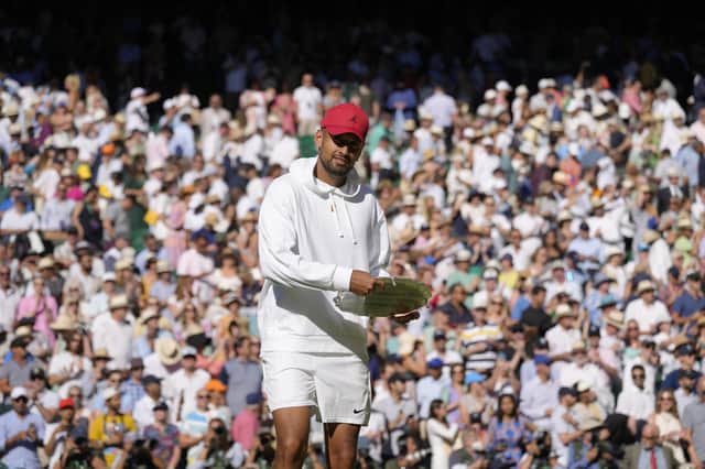 Australia's Nick Kyrgios pretends to use the runners-up trophy as a frisbee after losing to Serbia's Novak Djokovic in the final of the men's singles.
