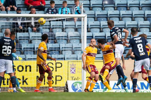 Lee Ashcroft heads home Dundee's winning goal. Picture: SNS