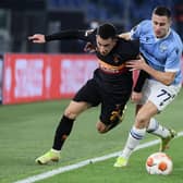 Lazio's Montenegrin midfielder Adam Marusic (R) holds back Galatasaray's Romanian midfielder Olimpiu Morutan.