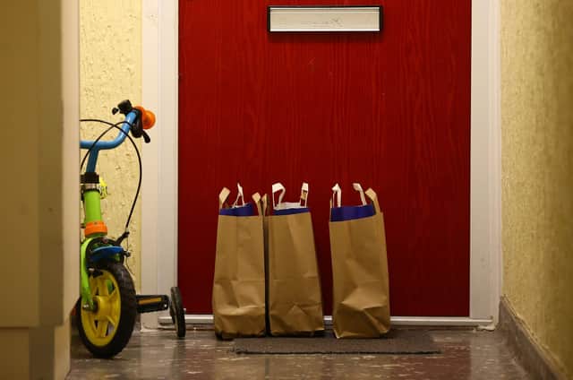 Bags containing meals for school children during lockdown. Picture: HOLLIE ADAMS/AFP via Getty Images