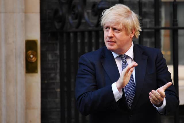 Boris Johnson applauds key workers, including the NHS staff who saved his life, outside 10 Downing Street last week (Picture: Leon Neal/Getty Images)