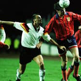 Duncan Ferguson winning one of his seven caps for Scotland in a friendly against Germany in 1993. He has said his "biggest regret" was not playing more times for Scotland.