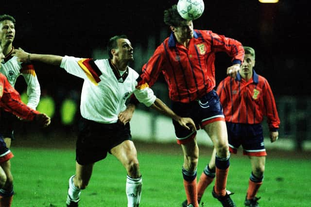 Duncan Ferguson winning one of his seven caps for Scotland in a friendly against Germany in 1993. He has said his "biggest regret" was not playing more times for Scotland.