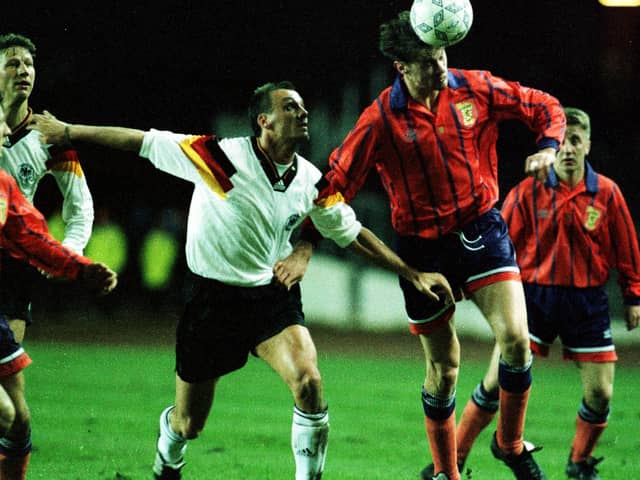 Duncan Ferguson winning one of his seven caps for Scotland in a friendly against Germany in 1993. He has said his "biggest regret" was not playing more times for Scotland.