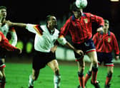 Duncan Ferguson winning one of his seven caps for Scotland in a friendly against Germany in 1993. He has said his "biggest regret" was not playing more times for Scotland.