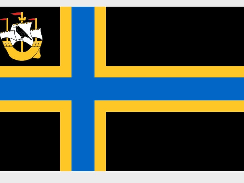 Caithness is a historic county located in the very north of Scotland, this flag - used since 2016 - represents the unique identity of this region of Scotland as it is connected to nordic culture and Vikings, as represented by the cross, while the blue and gold represent the sea and beaches of the area. The maritime heritage of Caithness is represented by the boat and the raven on its sail also appears on the county’s civic arms.