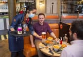 Patrons are served in The Huxley in Edinburgh in line with parts of the country moving into level two restrictions, while Glasgow remains in level three. Picture: Lisa Ferguson