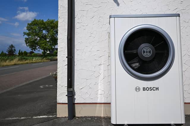 A photo shows a heat pump at a house in Boenen, western Germany on July 5, 2023. After a long struggle between the governing parties, the new heating law is to be passed in the Bundestag on July 7, 2023. (Photo by Ina FASSBENDER / AFP) (Photo by INA FASSBENDER/AFP via Getty Images)