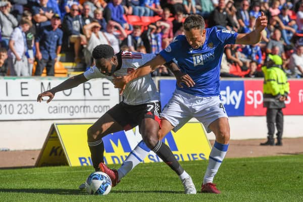 Aberdeen's Shayden Morris and St Johnstone's Andy Considine during Saturday's clash at McDiarmid Park.