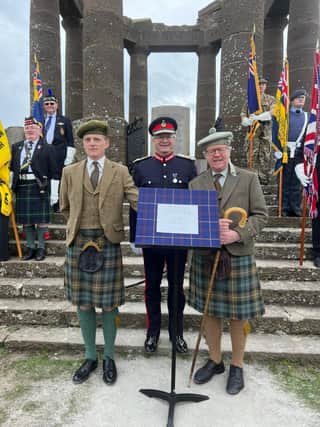 The Honourable Charles Pearson (right) and his son George Pearson (left) with the Lord Lieutenant of Kincardineshire Alastair Macphie beside the plaque (Pic: Carlo Williams)