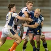 Duhan van der Merwe, centre in white, tries to wrestle the ball from his brother Akker during Edinburgh's 16-15 win over the Sale Sharks at the AJ Bell Stadium in the European Champions Cup in 2020. Mandatory Credit:  (Photo by Roger Evans/Action Plus/Shutterstock)