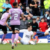 Jon McLaughlin fouls Paul McMullan in the box during Rangers' win over Dundee.