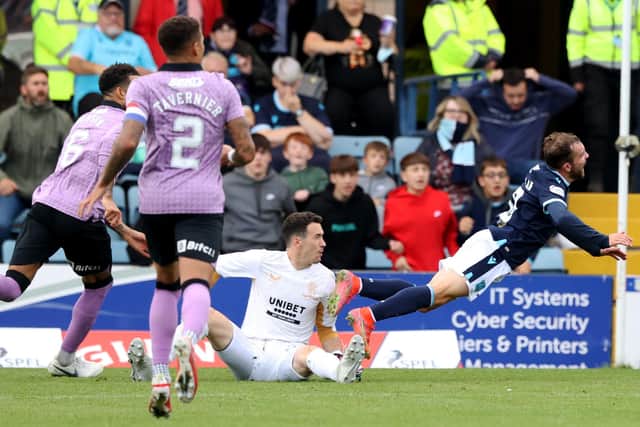 Jon McLaughlin fouls Paul McMullan in the box during Rangers' win over Dundee.