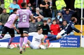 Jon McLaughlin fouls Paul McMullan in the box during Rangers' win over Dundee.