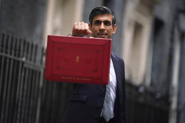 Chancellor of the Exchequer Rishi Sunak holds his ministerial 'Red Box' outside 11 Downing Street, London, before delivering his Budget to the House of Commons.