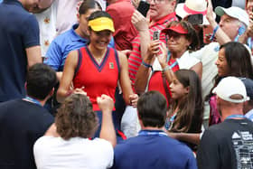 Emma Raducanu celebrates with her coaches after winning the US Open, but their working relationship is over.