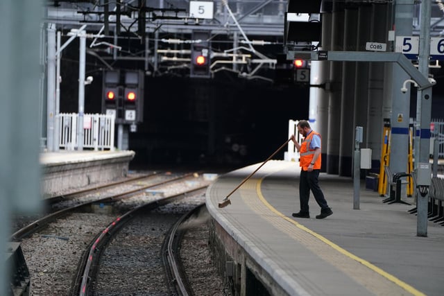 A platform is swept at an eerily empty Glasgow Queen Street as members of the Rail, Maritime and Transport union begin their nationwide strike in a bitter dispute over pay, jobs and conditions.