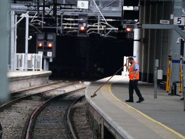 A platform is swept at an eerily empty Glasgow Queen Street as members of the Rail, Maritime and Transport union begin their nationwide strike in a bitter dispute over pay, jobs and conditions.