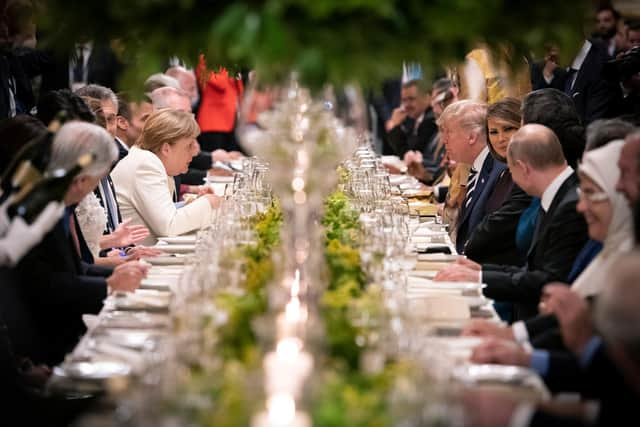 German Chancellor Angela Merkel talks to the then US President Donald Trump during a meeting of G20 countries, which include the UK, China, Russia, Brazil, and Saudi Arabia, in Buenos Aires in 2018 (Picture: Guido Bergmann/Bundesregierung via Getty Images)