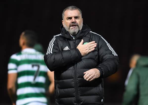 Celtic manager Ange Postecoglou celebrates with the travelling fans after the 2-1 win over Motherwell at Fir Park. (Photo by Ross MacDonald / SNS Group)