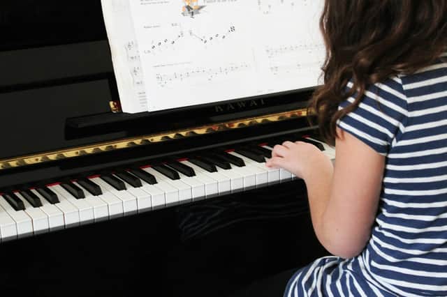 Scotland is 'rapidly moving' towards a situation where only children from wealthy families can learn to play a musical instrument, claims teaching union.