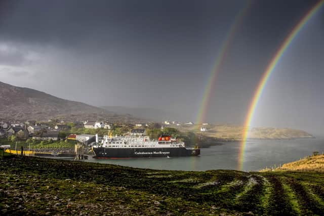 A rainbow over the MV Hebrides as it docks at Tarbert,on the Outer Hebrides from the book Scotland's Islands. Photographed and published by Allan Wright Photographic
