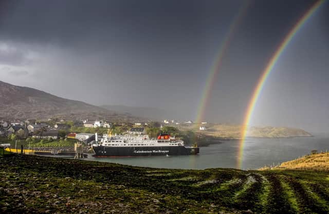 A rainbow over the MV Hebrides as it docks at Tarbert,on the Outer Hebrides from the book Scotland's Islands. Photographed and published by Allan Wright Photographic