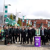 Celtic staff and players stand with the trophy before the cinch Premiership match against Motherwell at Celtic Park. (Photo credit: Jane Barlow/PA Wire)