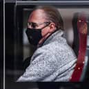A passenger on a bus on Princess Street wears a face mask at the height of the Covid pandemic in 2020. Picture: Jeff J Mitchell/Getty Images