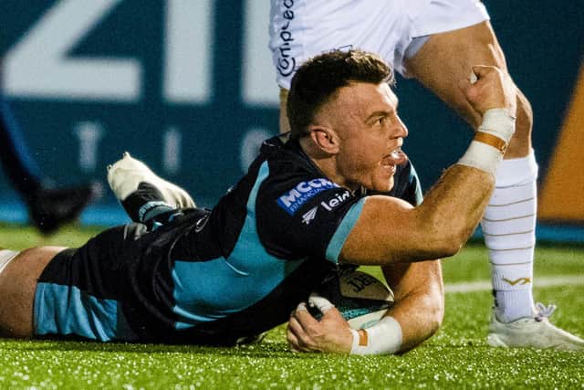 Jack Dempsey celebrates scoring Glasgow Warriors' third try against Dragons at Scotstoun. (Photo by Ross MacDonald / SNS Group)