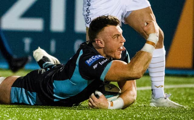 Jack Dempsey celebrates scoring Glasgow Warriors' third try against Dragons at Scotstoun. (Photo by Ross MacDonald / SNS Group)