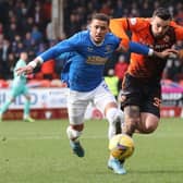 Dundee United's Tony Watt and Rangers' James Tavernier during a Cinch Premiership match in February.  (Photo by Alan Harvey / SNS Group)