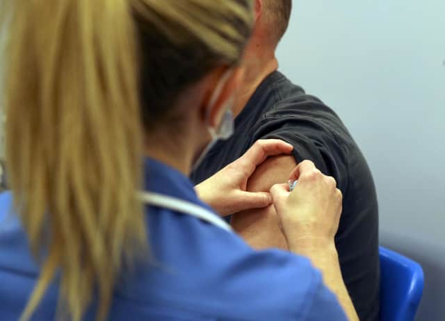 A person receiving a Covid-19 jab. Picture: PA Media