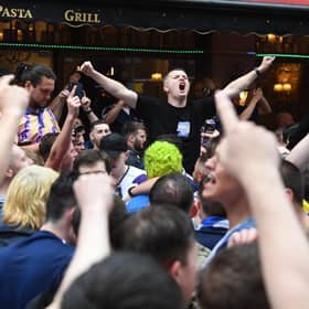 Scottish fans gather in Leicester Square in central London, ahead of the UEFA Euro 2020 match between England and Scotland at Wembley Stadium. Picture date: Friday June 18, 2021.