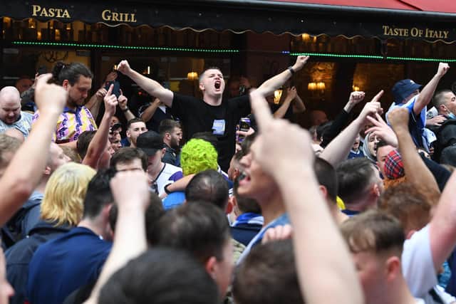 Scottish fans gather in Leicester Square in central London, ahead of the UEFA Euro 2020 match between England and Scotland at Wembley Stadium. Picture date: Friday June 18, 2021.