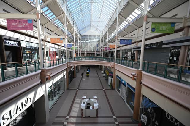 Insurance cover may be available for shopping centres forced to close all stores except for its pharmacy during the pandemic. Photo by OLI SCARFF/AFP via Getty Images