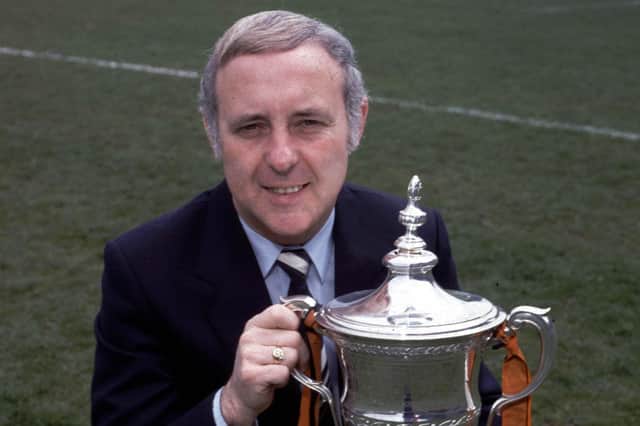 Jim McLean sits proudly with the Premier Division trophy which United won in season1982/83