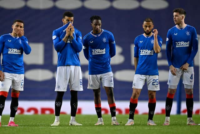 Rangers captain James Tavernier (far left) and his team-mates watch on in despair as they lose their Scottish Cup quarter-final clash with St Johnstone on penalties. Picture: SNS