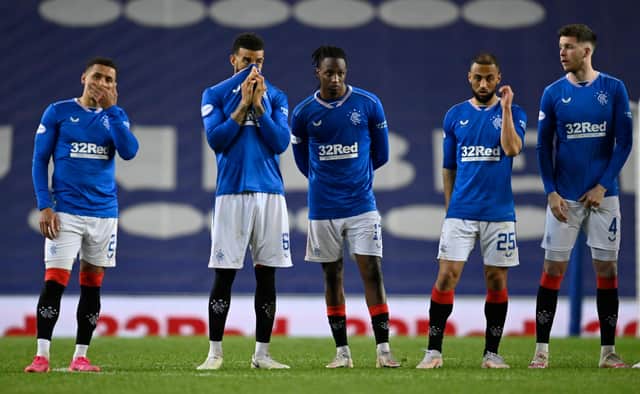 Rangers captain James Tavernier (far left) and his team-mates watch on in despair as they lose their Scottish Cup quarter-final clash with St Johnstone on penalties. Picture: SNS