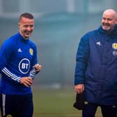 Scotland boss Steve Clarke with Leigh Griffiths in training at the Oriam. Picture: SSNS