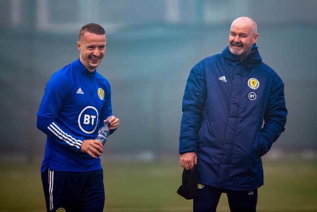 Scotland boss Steve Clarke with Leigh Griffiths in training at the Oriam. Picture: SSNS