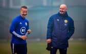 Scotland boss Steve Clarke with Leigh Griffiths in training at the Oriam. Picture: SSNS