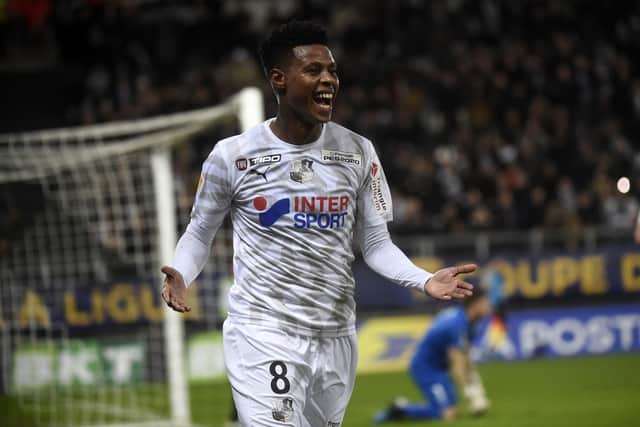Bongani Zungu celebrates after scoring a goal during the French Cup League football match between Amiens and Rennes  (Photo by FRANCOIS LO PRESTI/AFP via Getty Images)