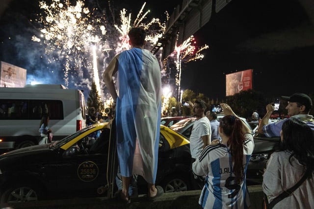 Soccer fans watch fireworks welcoming home the players from Qatar. AP Photo/Rodrigo Abd